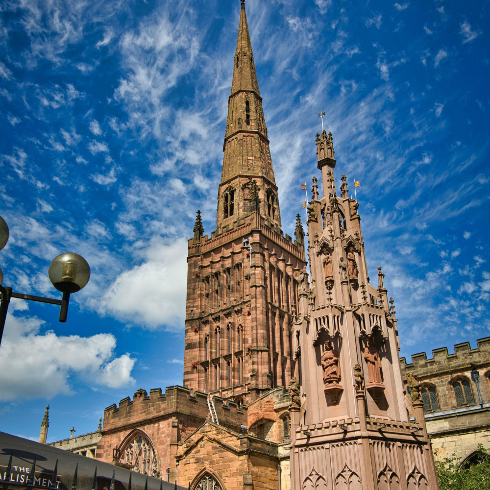 Historic cathedral under a blue sky with clouds.